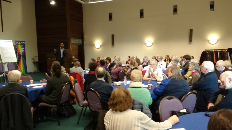 people in conference hall listening to speaker