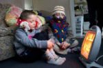 photo of children around an electric fire