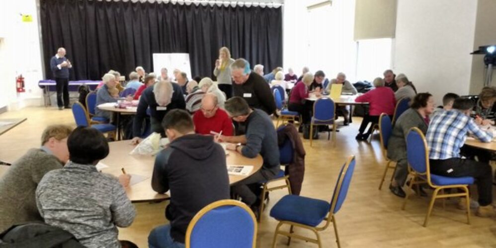 Table groups work on the budgeting exercise