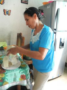 woman in kitchen with fridge