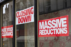 Shop front with poster saying it is closing down