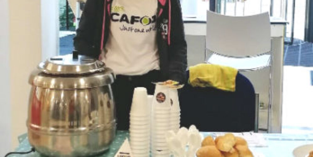 student behind CAFOD stall