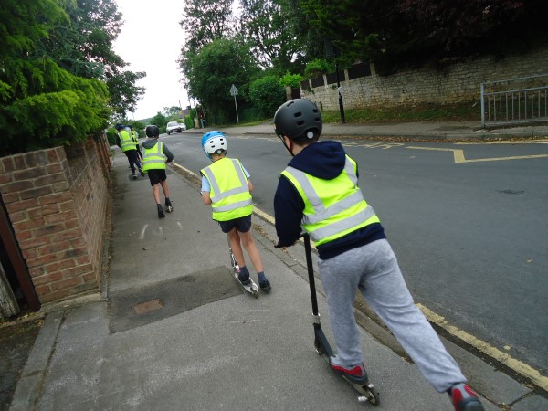 children on scooters