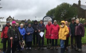 a group of people in the rain