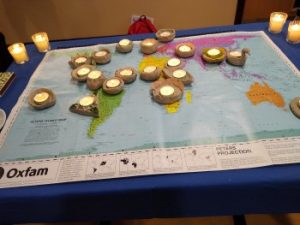 tea lights arranged on a world map