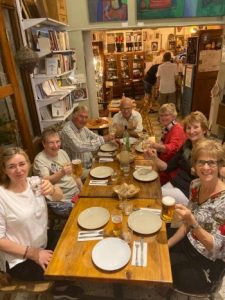 people sat at a table waiting for food