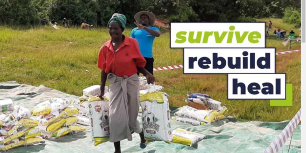 women carrying sacks of food