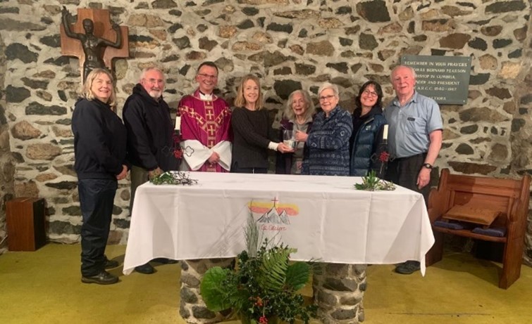 A group of people around an altar