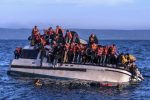 refugees clinging to sinking boat