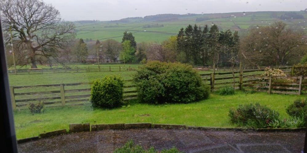 View from a large window over a valley