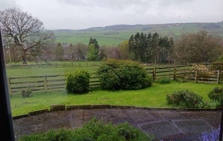 View from a large window over a valley