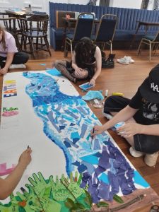 Young people working on a Frieze