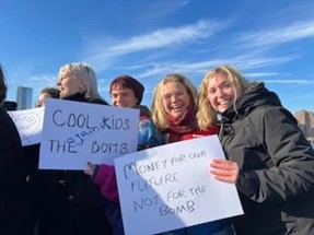 A group of young people holding placards