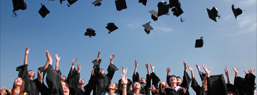 graduation Graduates throwing hats into the air